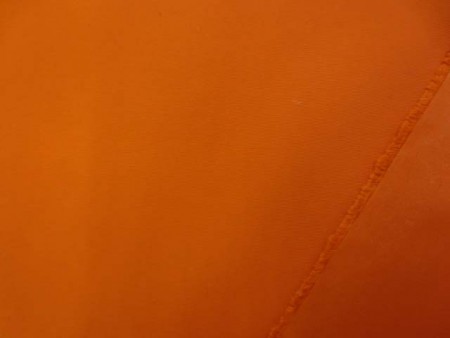 撥水　生地　撥水加工　ナイロン　高密度スタナータッサー　オレンジ　148cm幅　[MU1359]